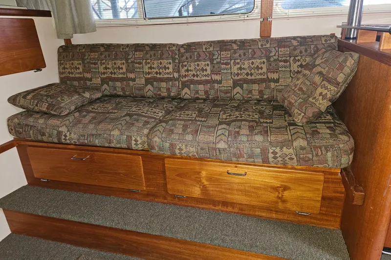 Slide: The Image of 1989 Tollycraft Sport Sedan kitchen with Princess oven and wooden cabinetry. - 15