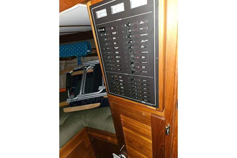 Slide: The Image of 1989 Tollycraft Sport Sedan bathroom with wooden cabinetry and sink. - 23