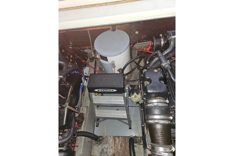 Slide: The Image of 1989 Tollycraft Sport Sedan engine compartment with MerCruiser engine visible. - 27