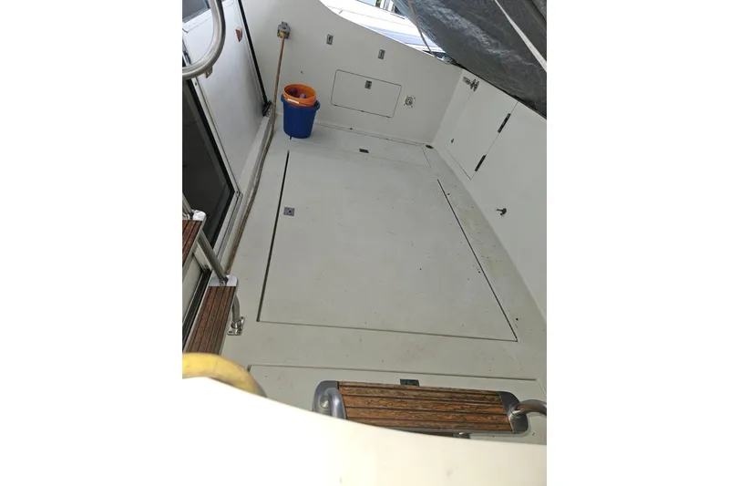 Slide: The Image of 1989 Tollycraft Sport Sedan engine room with batteries and wiring components. - 28