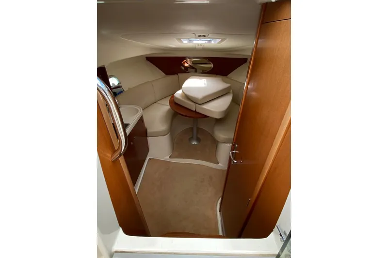 Slide: The Image of Interior of 2009 Jeanneau Leader 805 boat with cozy seating and wooden finishes. - 2
