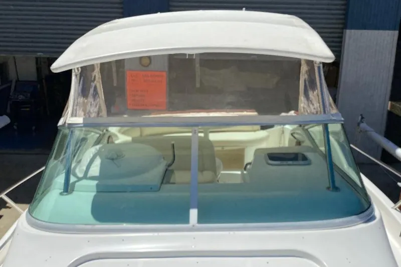 Slide: The Image of 2009 Jeanneau Leader 805 boat with covered cockpit and clear windshield. - 3