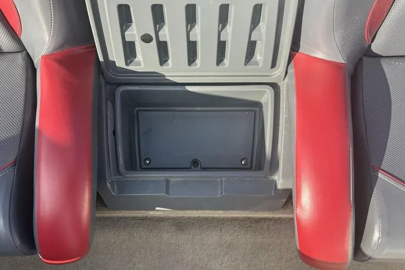 Slide: The Image of 2024 ProCraft 185 Pro boat interior storage compartment with red and gray seating. - 16