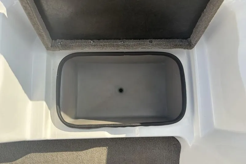 Slide: The Image of 2024 ProCraft 185 Pro boat storage compartment, open lid, interior view. - 19