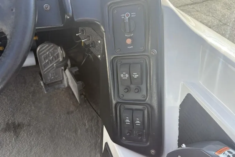 Slide: The Image of Control panel of 2024 ProCraft 185 Pro boat, featuring switches and pedals. - 24