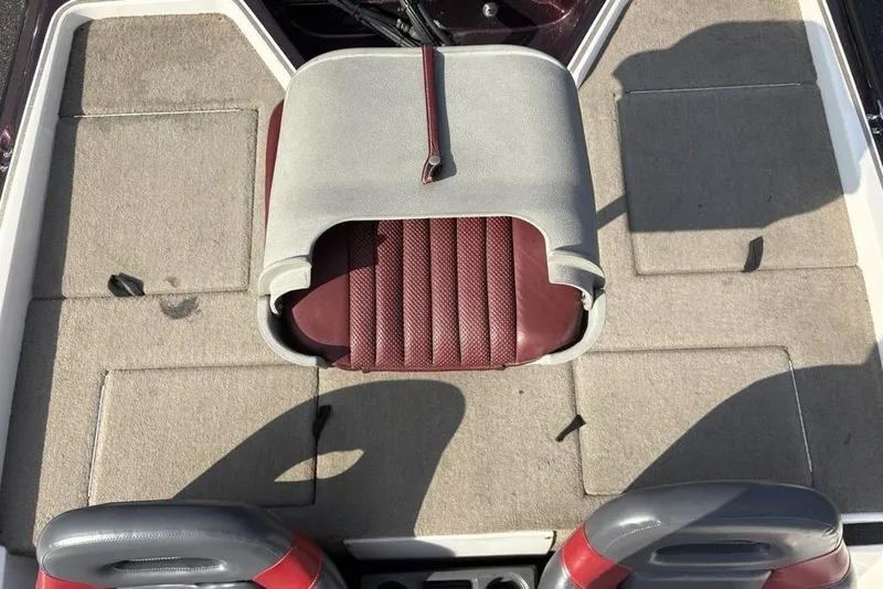 Slide: The Image of 2024 ProCraft 185 Pro boat interior with gray and maroon seating and carpeted flooring. - 25
