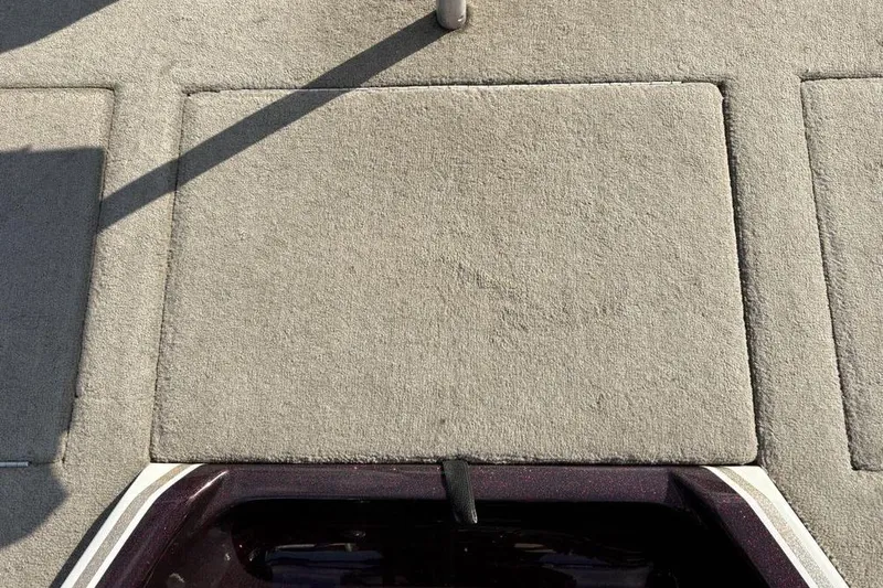 Slide: The Image of Carpeted deck of 2024 ProCraft 185 Pro boat, featuring storage compartments. - 29