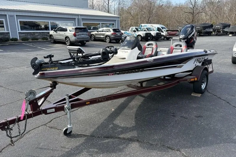 Slide: The Image of 2024 ProCraft 185 Pro fishing boat on trailer in parking lot. - 3