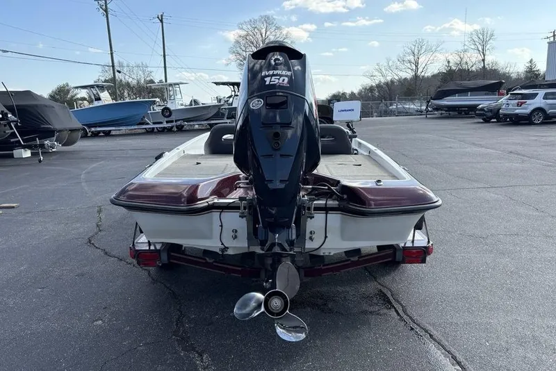 Slide: The Image of 2024 ProCraft 185 Pro boat with Evinrude 150 engine in parking lot. - 8