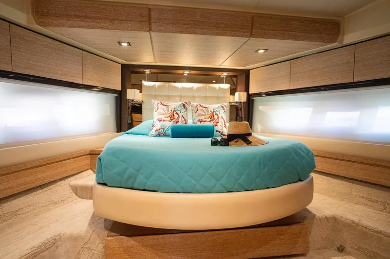 Slide: The Image of Luxurious bedroom interior of 2011 Azimut 70 yacht with elegant decor and ambient lighting. - 12