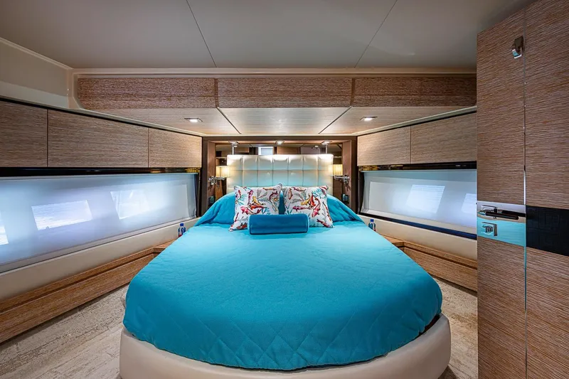 Slide: The Image of Luxurious bedroom interior of 2011 Azimut 70 yacht with blue bedding and modern design. - 19
