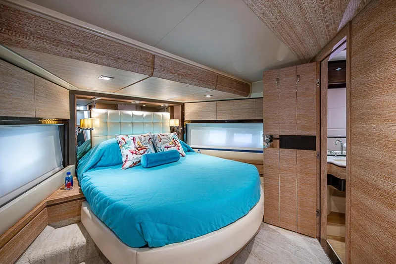 Slide: The Image of Luxurious bedroom interior of 2011 Azimut 70 yacht with modern design and blue bedding. - 20