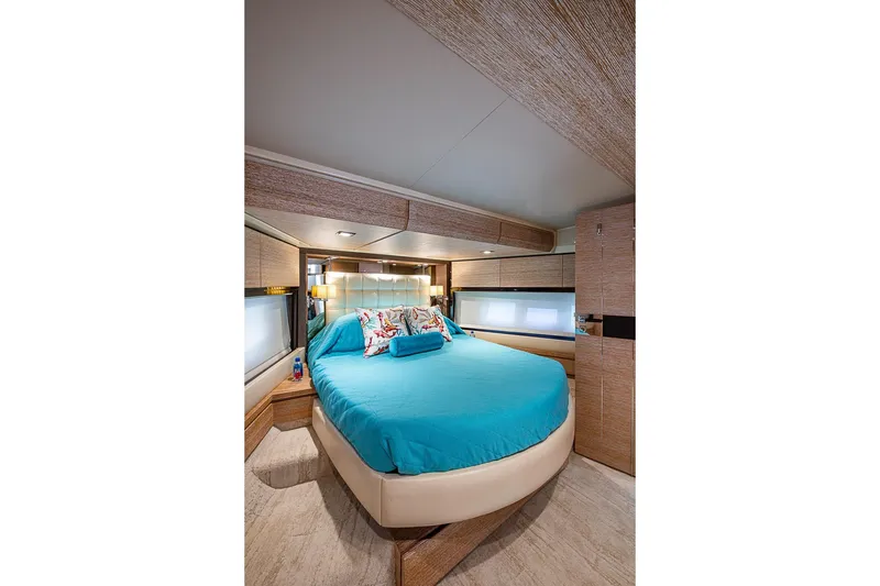 Slide: The Image of Luxurious bedroom interior of 2011 Azimut 70 yacht with modern design and blue bedding. - 21