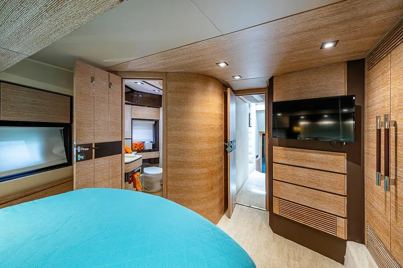 Slide: The Image of Luxurious interior of 2011 Azimut 70 yacht with modern wood paneling and flat-screen TV. - 22