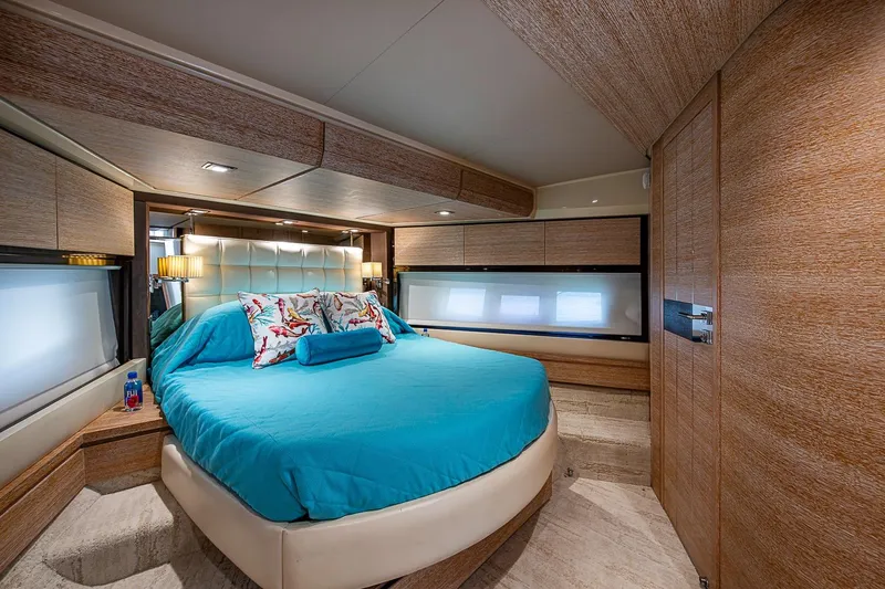 Slide: The Image of Luxurious bedroom interior of 2011 Azimut 70 yacht with modern design and blue bedding. - 24