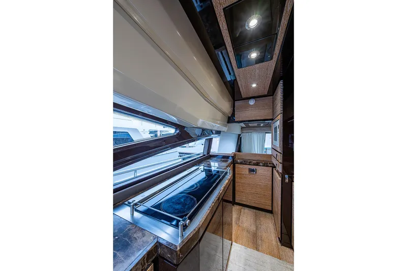 Slide: The Image of Luxurious kitchen interior of 2011 Azimut 70 yacht with modern appliances and sleek design. - 27