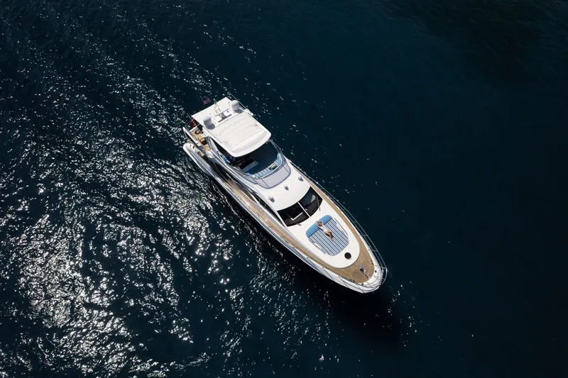 Slide: The Image of Aerial view of 2011 Azimut 70 yacht cruising on dark blue water. - 3