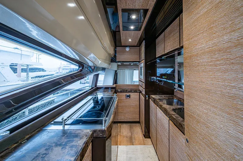 Slide: The Image of Luxurious kitchen interior of 2011 Azimut 70 yacht with modern appliances and sleek design. - 32