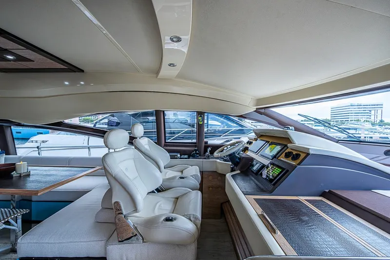 Slide: The Image of Luxurious interior of a 2011 Azimut 70 yacht with modern helm and seating. - 35