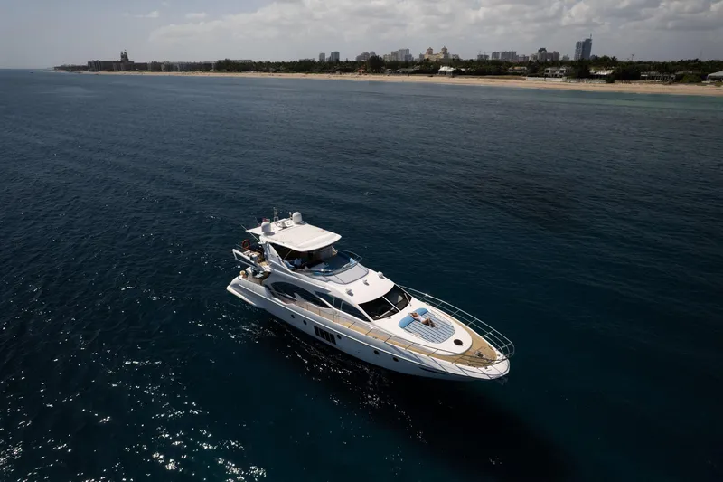 Slide: The Image of Luxurious 2011 Azimut 70 yacht cruising near scenic coastline. - 4