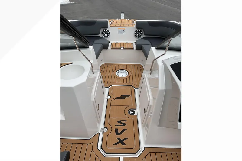 Slide: The Image of 2026 Starcraft SVX 190 OB boat interior with teak flooring and cushioned seating. - 10
