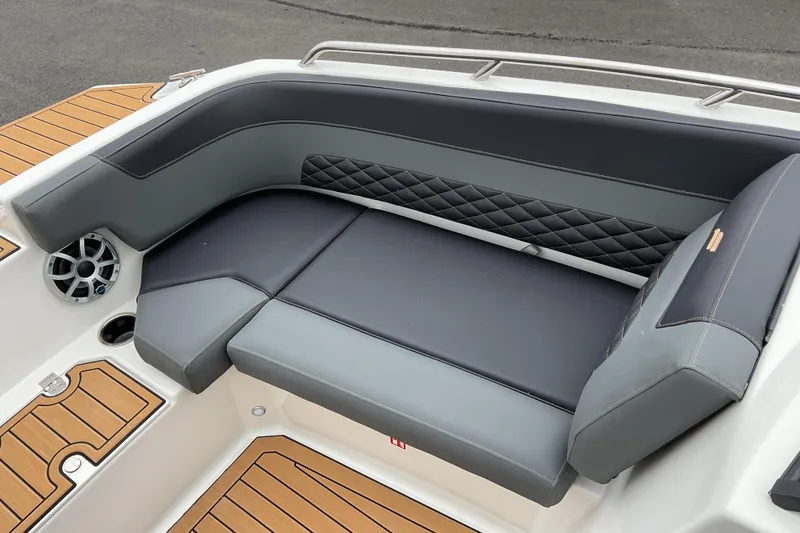 Slide: The Image of 2026 Starcraft SVX 190 OB boat interior with cushioned seating and wood accents. - 12