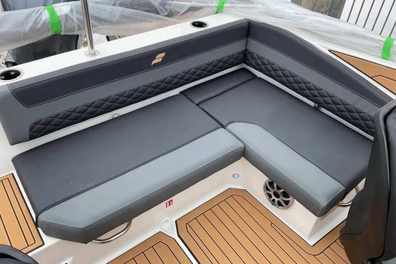 Slide: The Image of Luxurious seating on 2026 Starcraft SVX 190 OB boat, featuring sleek black upholstery. - 13