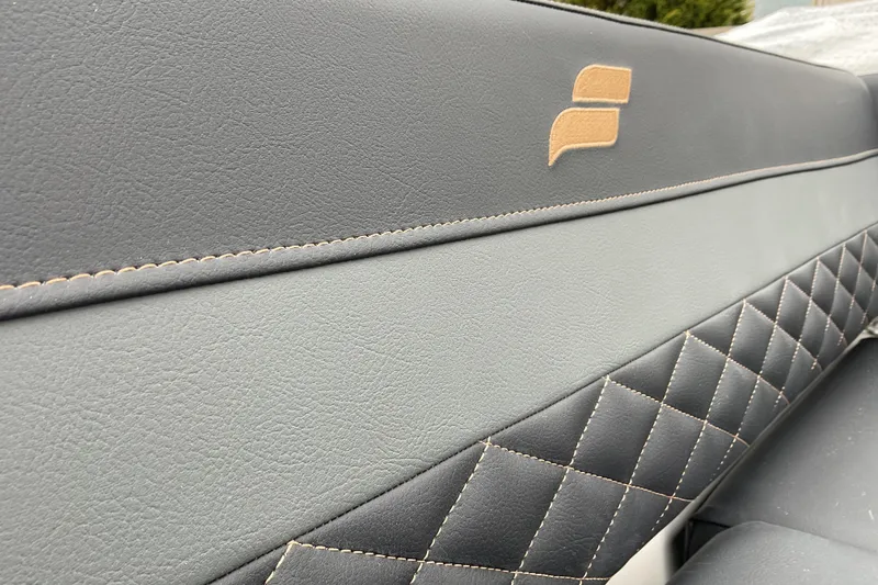 Slide: The Image of 2026 Starcraft SVX 190 OB interior with quilted leather upholstery and logo detail. - 18