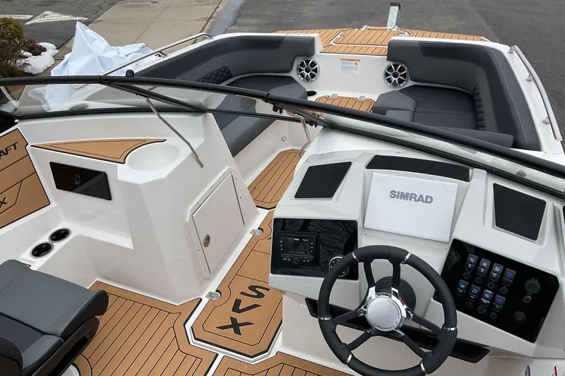 Slide: The Image of 2026 Starcraft SVX 190 OB boat interior with modern dashboard and seating. - 4