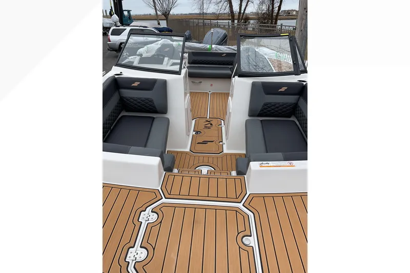 Slide: The Image of 2026 Starcraft SVX 190 OB boat interior with sleek seating and stylish deck design. - 7