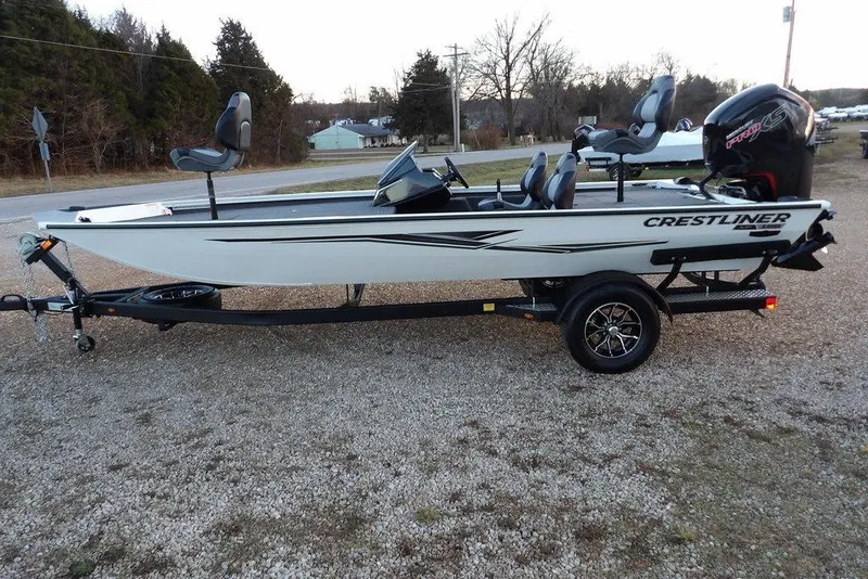 Slide: The Image of 2026 Crestliner XF 189 fishing boat on trailer, parked outdoors. - 10