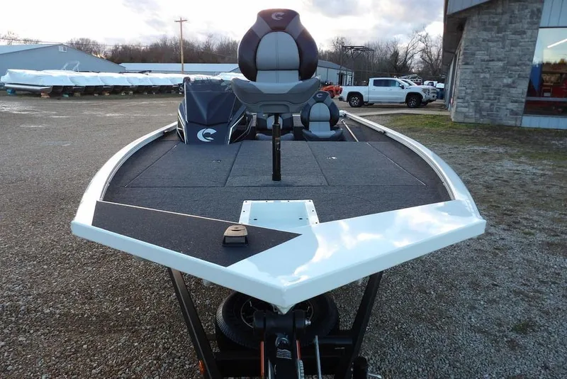 Slide: The Image of 2026 Crestliner XF 189 boat, front view, parked outdoors on gravel. - 11