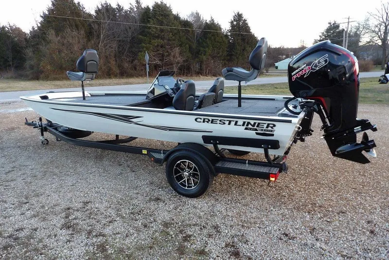 Slide: The Image of 2026 Crestliner XF 189 fishing boat on trailer, featuring a powerful outboard motor. - 12