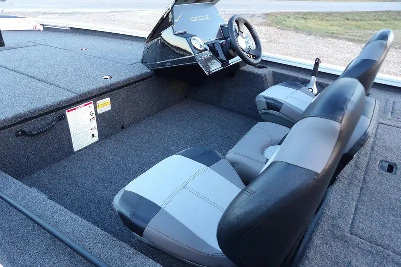 Slide: The Image of 2026 Crestliner XF 189 boat interior with dual seats and steering console. - 16