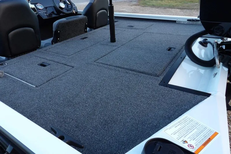 Slide: The Image of 2026 Crestliner XF 189 boat interior with spacious carpeted deck and seating. - 19