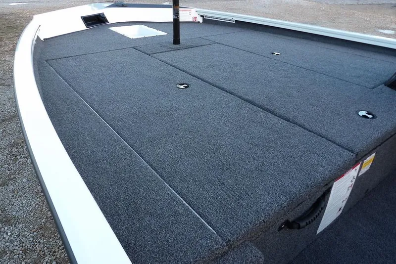 Slide: The Image of 2026 Crestliner XF 189 boat deck with carpeted surface and storage compartments. - 20