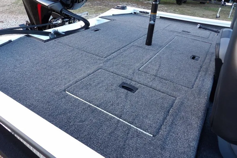 Slide: The Image of 2026 Crestliner XF 189 boat deck with storage compartments and motor. - 21