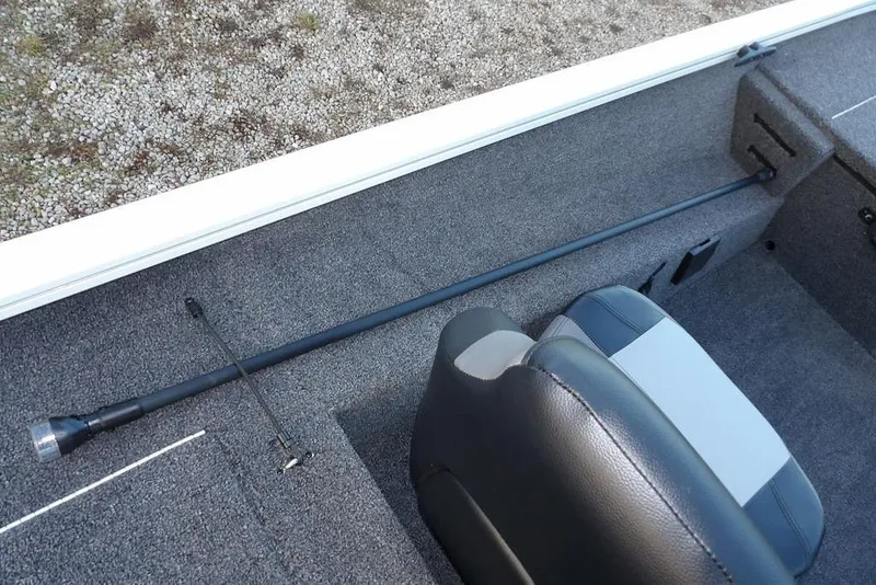 Slide: The Image of 2026 Crestliner XF 189 boat interior with rod storage and seating. - 23