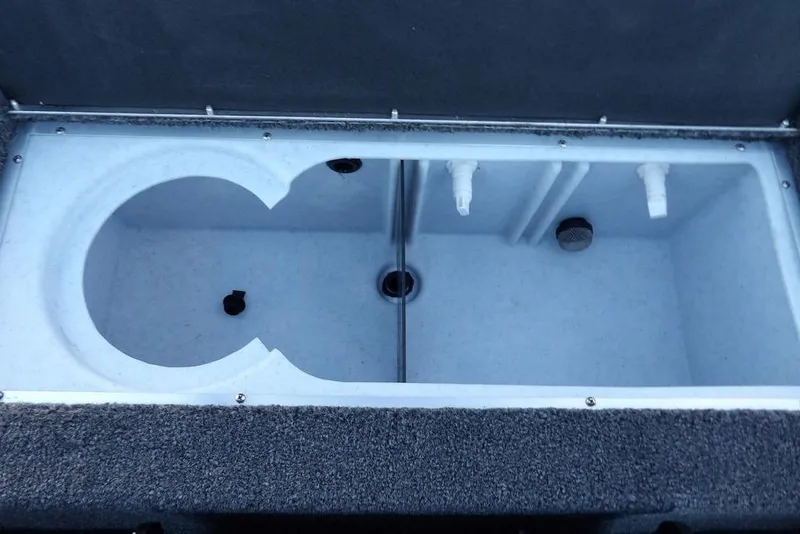 Slide: The Image of 2026 Crestliner XF 189 livewell interior with plumbing and drainage features. - 25