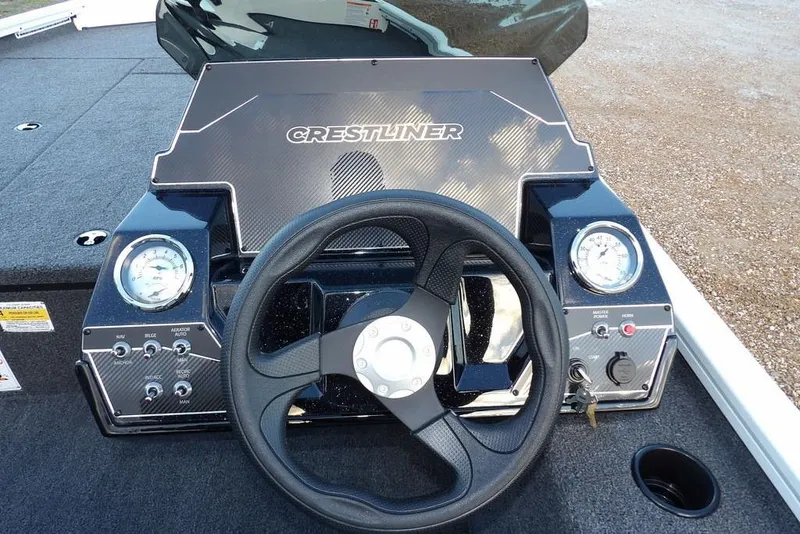 Slide: The Image of 2026 Crestliner XF 189 boat dashboard with steering wheel and gauges. - 29