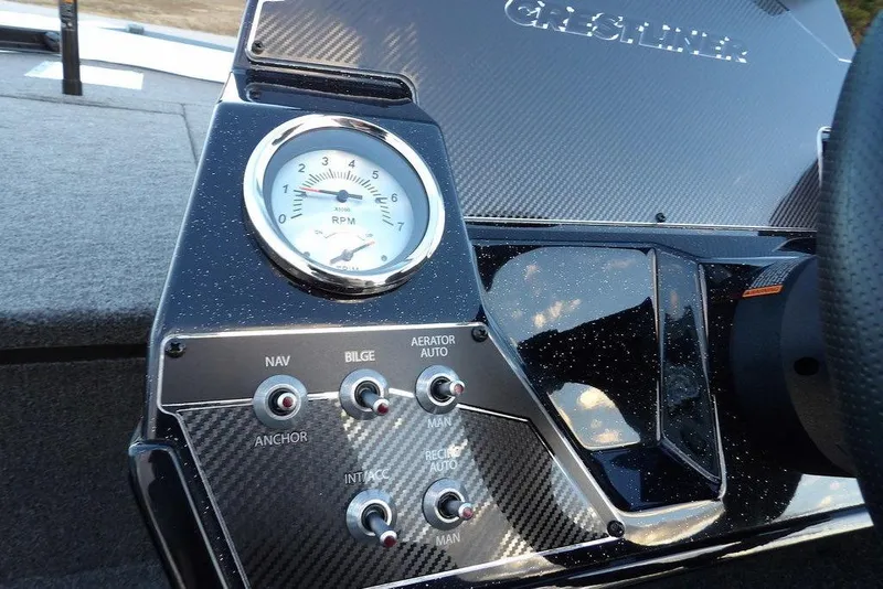 Slide: The Image of 2026 Crestliner XF 189 dashboard with RPM gauge and control switches. - 30