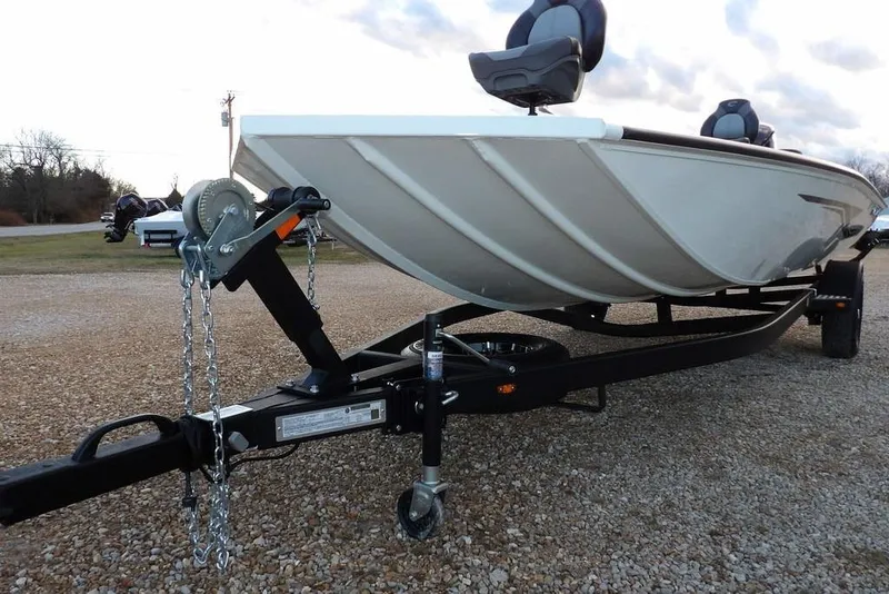 Slide: The Image of 2026 Crestliner XF 189 boat on trailer, parked on gravel. - 37