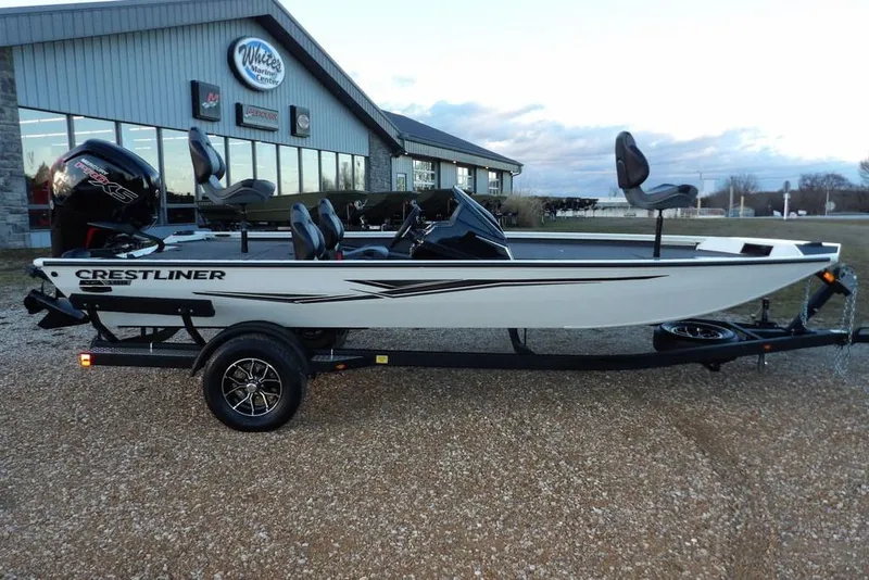 Slide: The Image of 2026 Crestliner XF 189 boat on trailer outside dealership. - 6