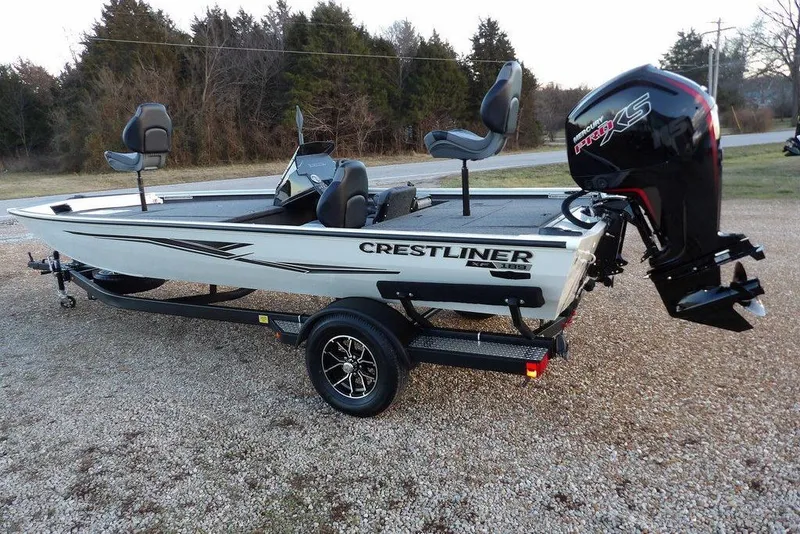 Slide: The Image of 2026 Crestliner XF 189 fishing boat on trailer, featuring a powerful outboard motor. - 7