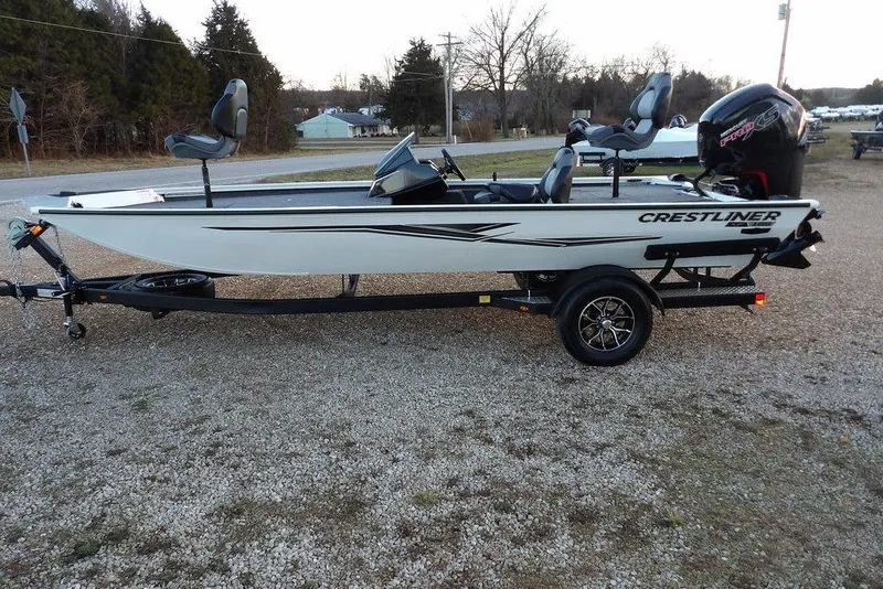 Slide: The Image of 2026 Crestliner XF 189 fishing boat on trailer, parked outdoors. - 8