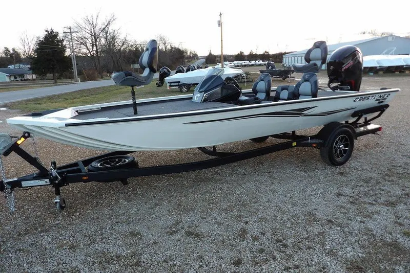 Slide: The Image of 2026 Crestliner XF 189 fishing boat on trailer, parked outdoors. - 9