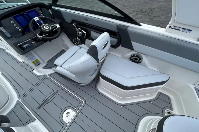 Slide: The Image of 2026 Chaparral SSX 4 boat interior with sleek dashboard and modern seating design. - 11