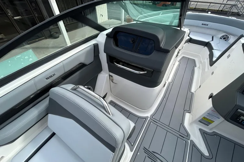 Slide: The Image of 2026 Chaparral SSX 4 boat interior with sleek seating and modern dashboard design. - 14