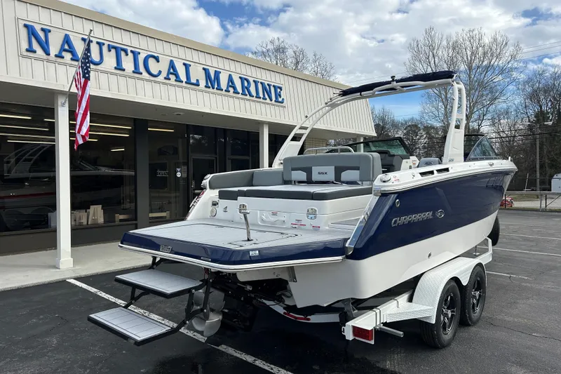 Slide: The Image of 2026 Chaparral SSX 4 boat on trailer outside Nautical Marine dealership. - 16