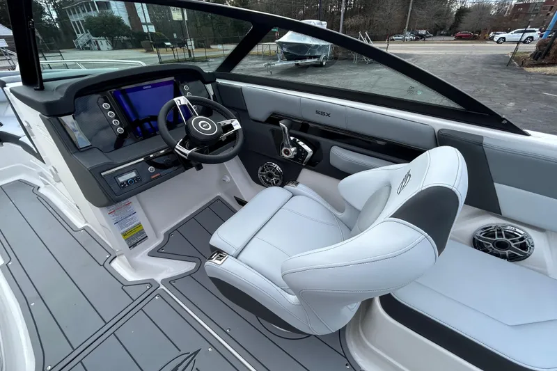 Slide: The Image of 2026 Chaparral SSX 4 boat interior with modern dashboard and steering wheel. - 17